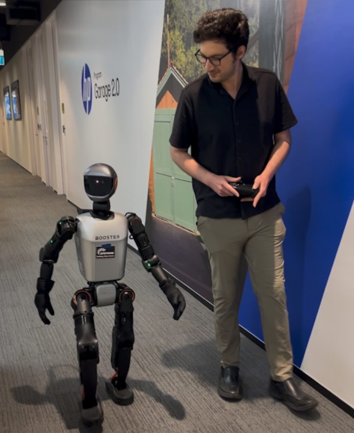 Synthium testing sim-to-real transfer on a Booster humanoid robot